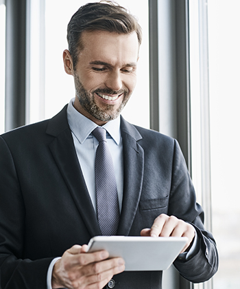 man typing on tablet